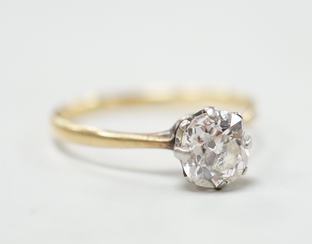 An 18ct, plat and solitaire diamond ring, size M/N, gross weight 1.8 grams, the stone measuring approx. 6.0mm by 5.2mm.